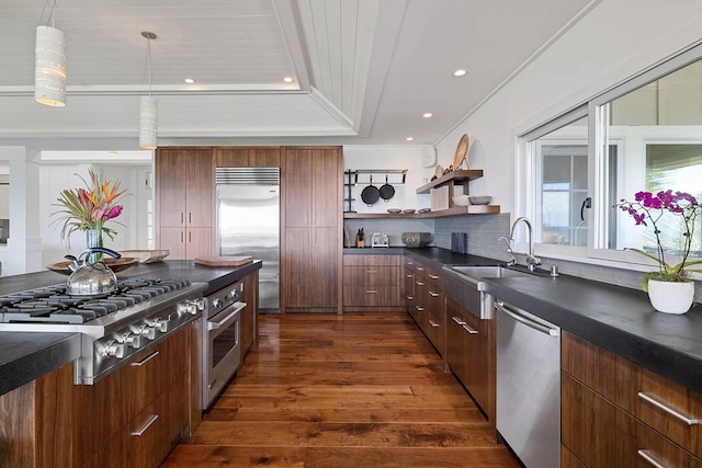 kitchen with sink, dark wood-type flooring, wooden ceiling, stainless steel appliances, and backsplash