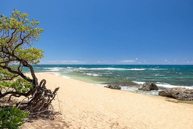 view of water feature with a beach view