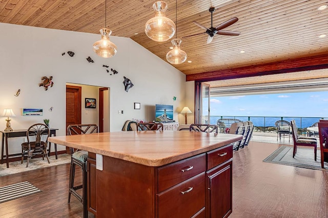 kitchen with wood ceiling, hanging light fixtures, a breakfast bar area, dark wood-type flooring, and a center island