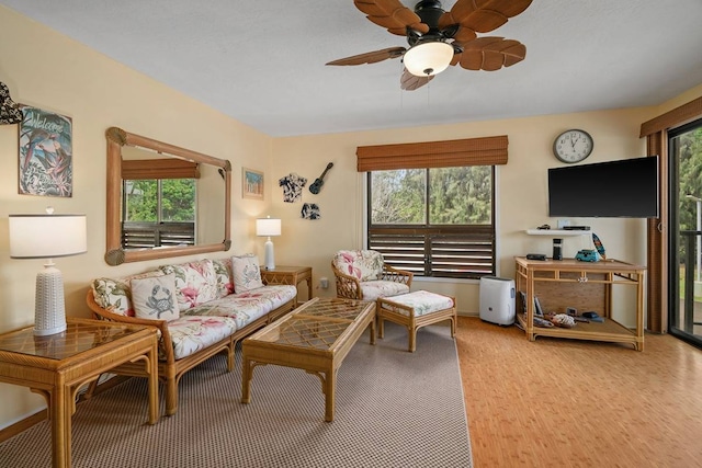 living room with ceiling fan, a healthy amount of sunlight, and wood-type flooring