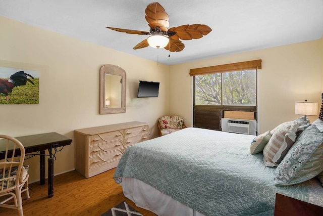 bedroom with ceiling fan and wood-type flooring