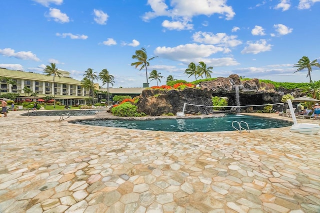 view of swimming pool with a patio area