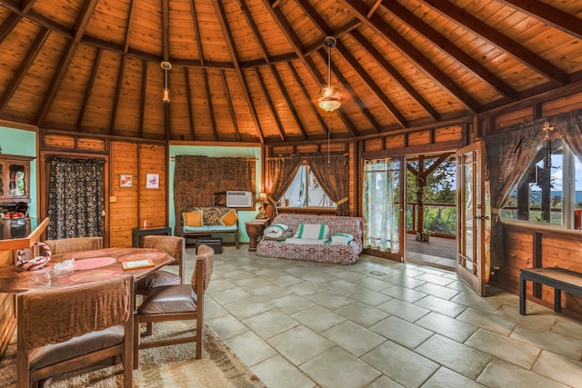 sunroom / solarium featuring wood ceiling, lofted ceiling with beams, and a wall mounted AC