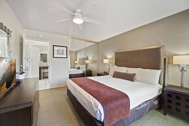 tiled bedroom featuring a closet and ceiling fan