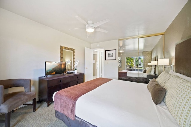 bedroom with ceiling fan and a closet