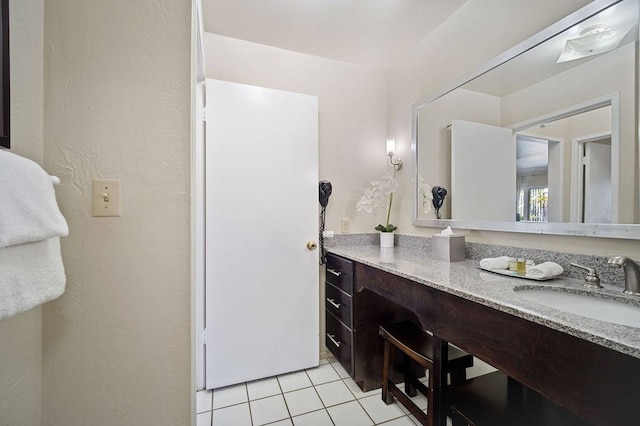 bathroom featuring oversized vanity and tile floors