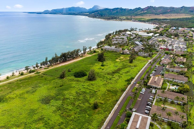 aerial view featuring a water and mountain view