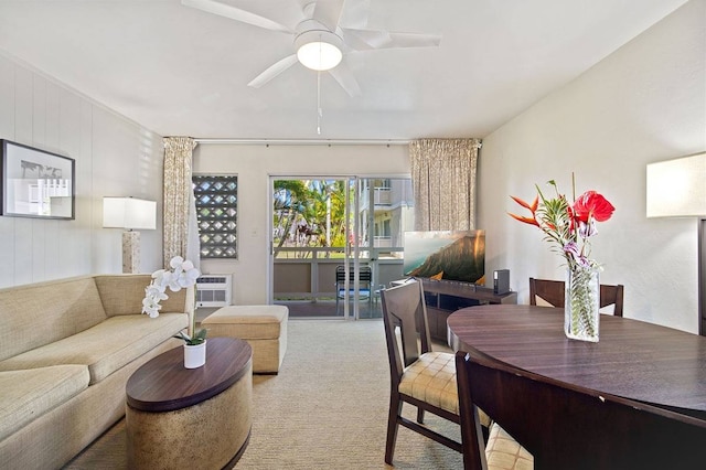 living room with light colored carpet and ceiling fan