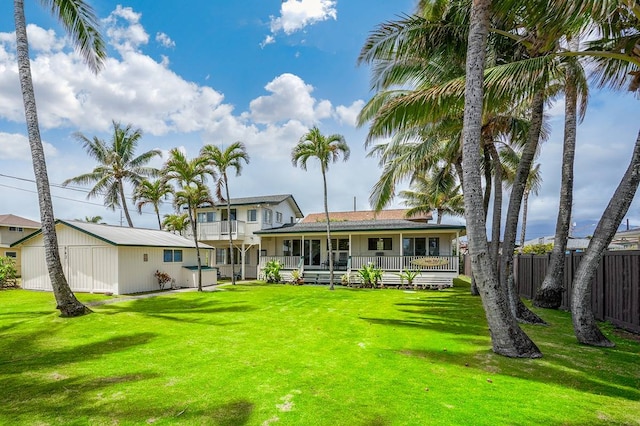 back of house featuring a yard