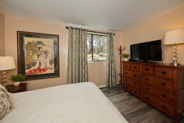 bedroom featuring dark wood-type flooring