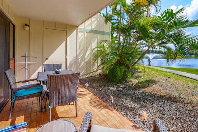 view of terrace featuring a water view