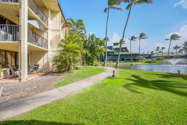 view of nearby features featuring a water view and a lawn