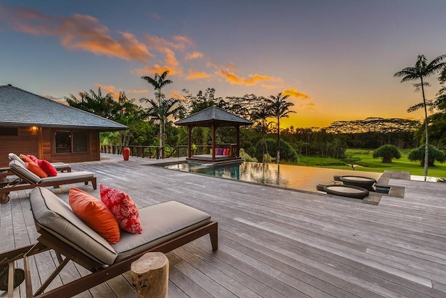 deck at dusk with a gazebo