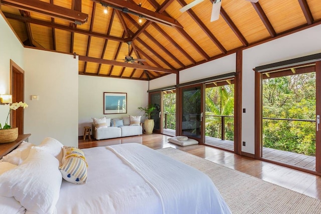 bedroom with multiple windows, wood ceiling, and access to exterior