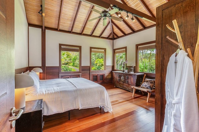 bedroom with ceiling fan, wood ceiling, beamed ceiling, high vaulted ceiling, and light wood-type flooring