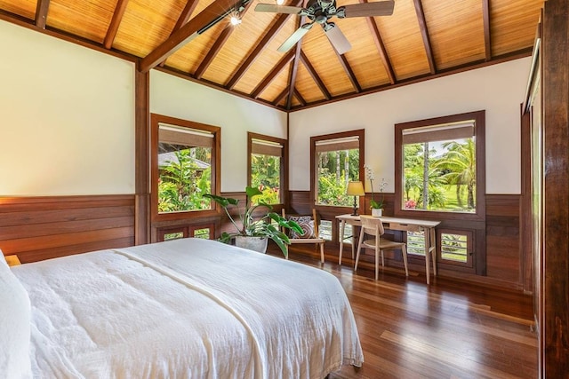 bedroom with wooden ceiling, multiple windows, and beamed ceiling