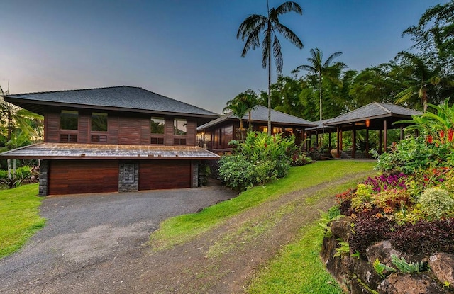 view of front of house with a front lawn and a garage