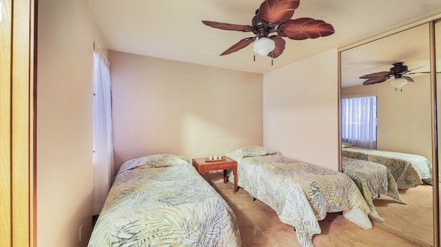 bedroom with tile patterned floors and ceiling fan