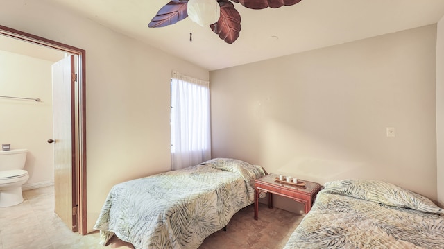 bedroom with tile patterned floors, connected bathroom, and ceiling fan