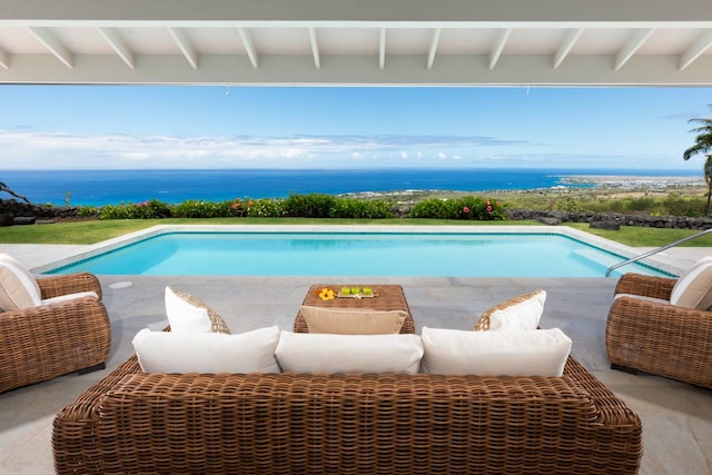 view of pool with an outdoor living space and a patio area