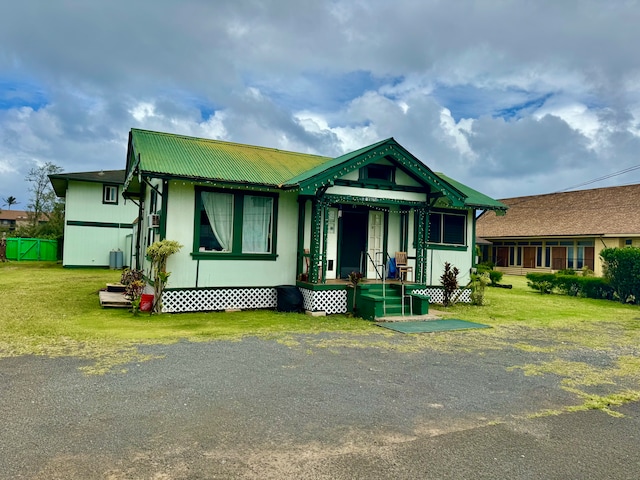 view of front of house with a front lawn and a porch