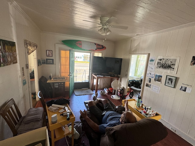 living room with ornamental molding, ceiling fan, and a healthy amount of sunlight