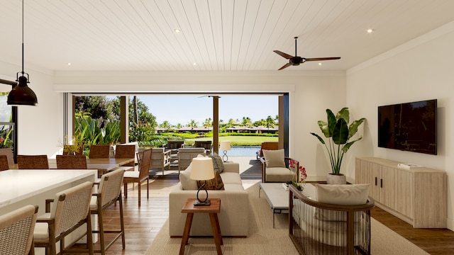 interior space with ceiling fan, plenty of natural light, and hardwood / wood-style flooring