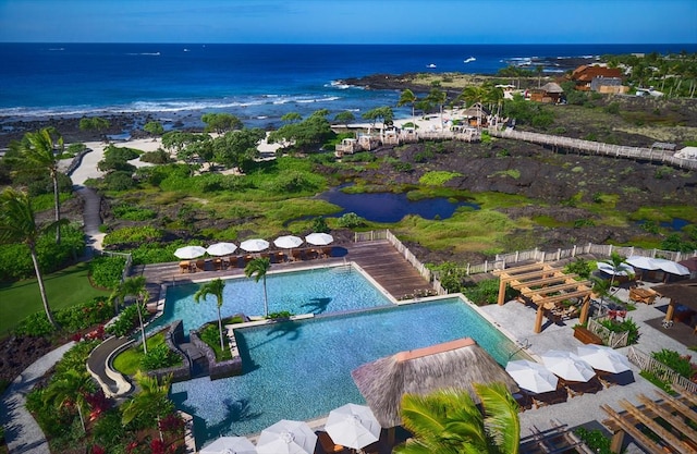 birds eye view of property with a water view