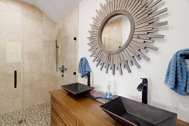 bathroom featuring walk in shower and sink