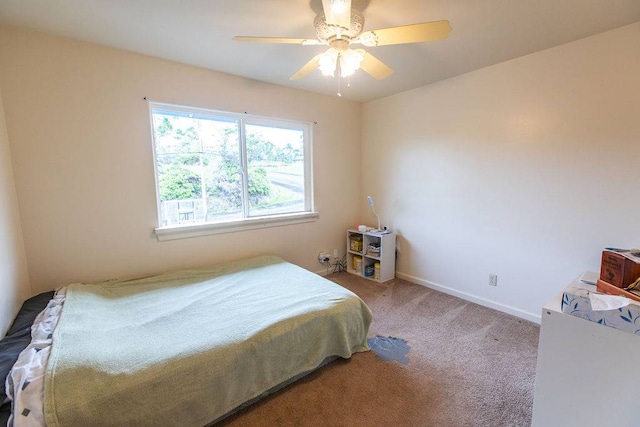 bedroom with ceiling fan and carpet