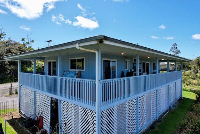 view of side of home with a porch