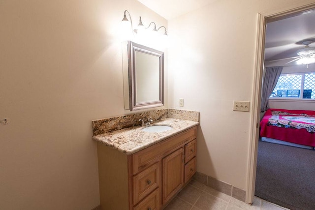 bathroom with tile flooring and vanity