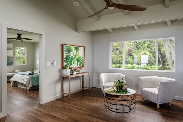 sitting room featuring dark hardwood / wood-style floors, ceiling fan, and beam ceiling