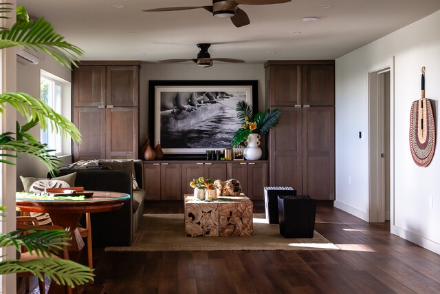 interior space with dark wood-type flooring and ceiling fan