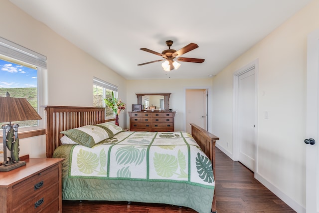 bedroom featuring ceiling fan and dark hardwood / wood-style floors