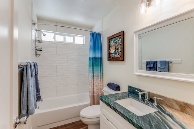 full bathroom featuring wood-type flooring, toilet, oversized vanity, and shower / tub combo with curtain