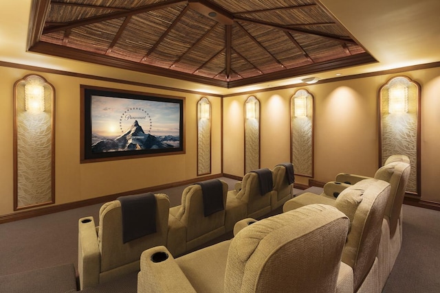 home theater room featuring carpet, wooden ceiling, and crown molding