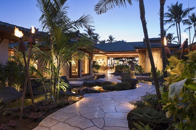 view of patio terrace at dusk