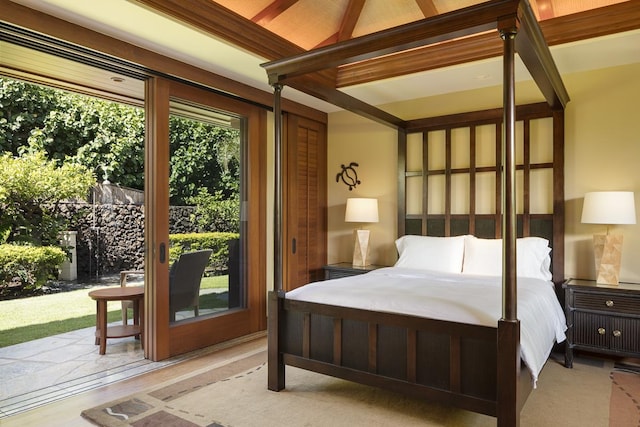 bedroom with beamed ceiling, access to exterior, and light hardwood / wood-style floors