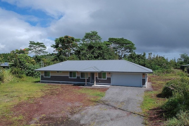 ranch-style home with a garage, a front lawn, and a porch