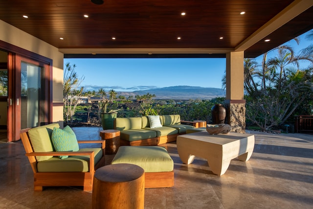 view of terrace featuring outdoor lounge area and a mountain view