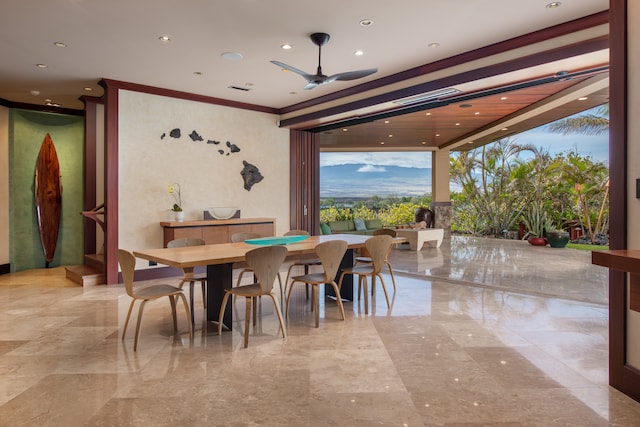 tiled dining space featuring ceiling fan