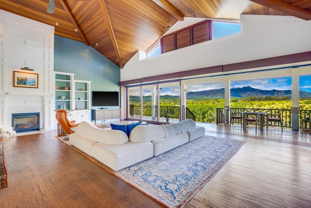 living room with wood-type flooring, wood ceiling, and high vaulted ceiling