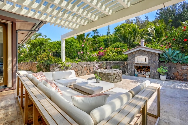 view of patio featuring an outdoor living space with a fireplace and a pergola