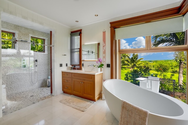 bathroom with crown molding, vanity, independent shower and bath, and tile patterned flooring