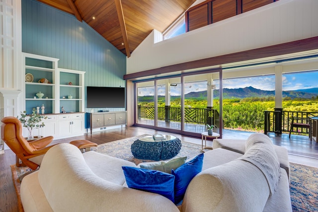 living room with wood ceiling, wood-type flooring, and high vaulted ceiling