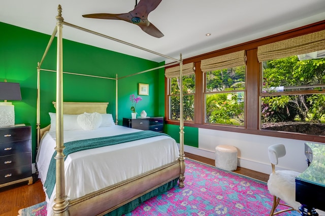 bedroom with hardwood / wood-style floors and ceiling fan