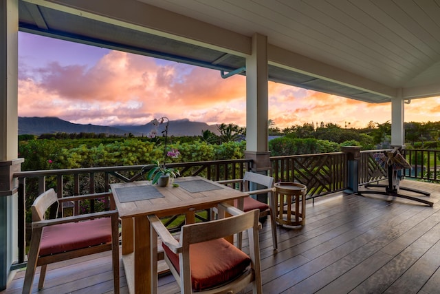 deck at dusk with a mountain view