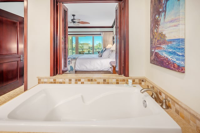 bathroom featuring ceiling fan and a bathtub