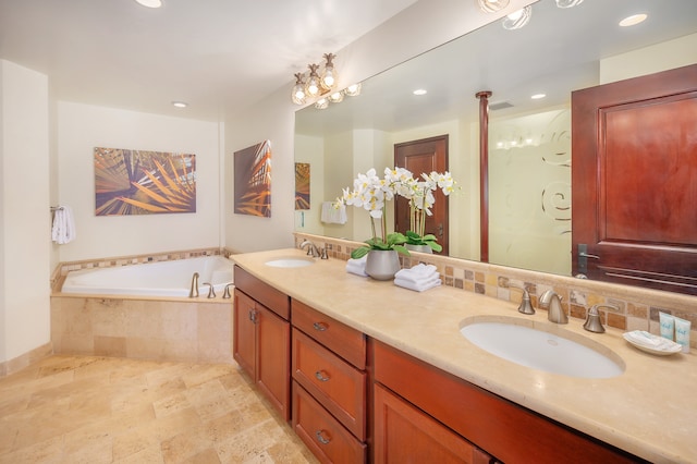 bathroom featuring tasteful backsplash, tiled tub, tile flooring, and dual vanity